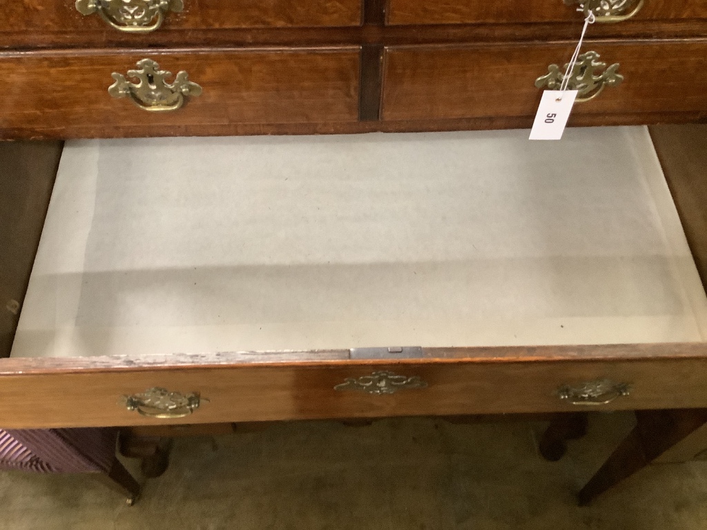 An 18th century oak chest on stand, width 100cm, depth 54cm, height 140cm